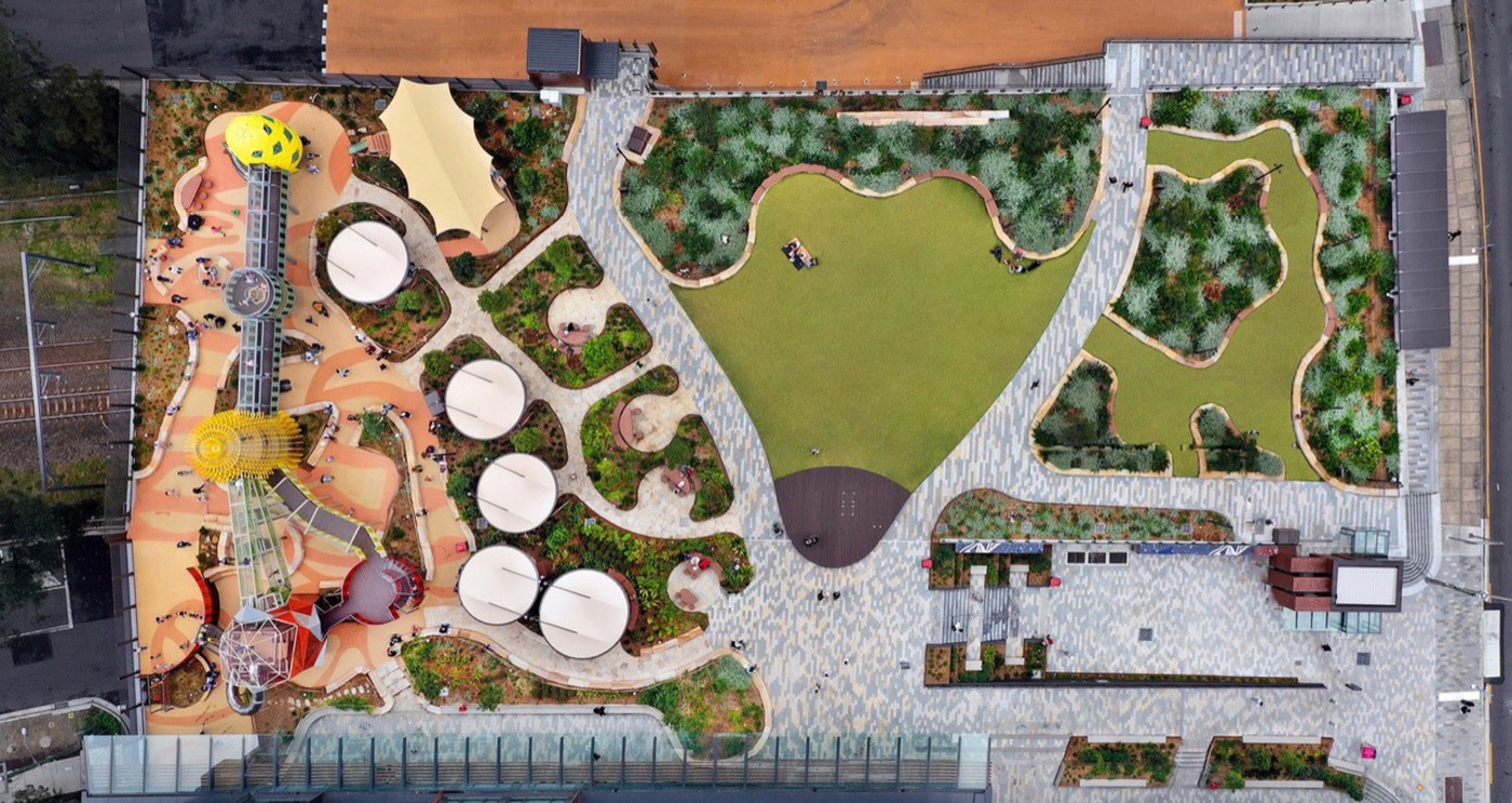 Aerial view of the entire park including the playground and green spaces.