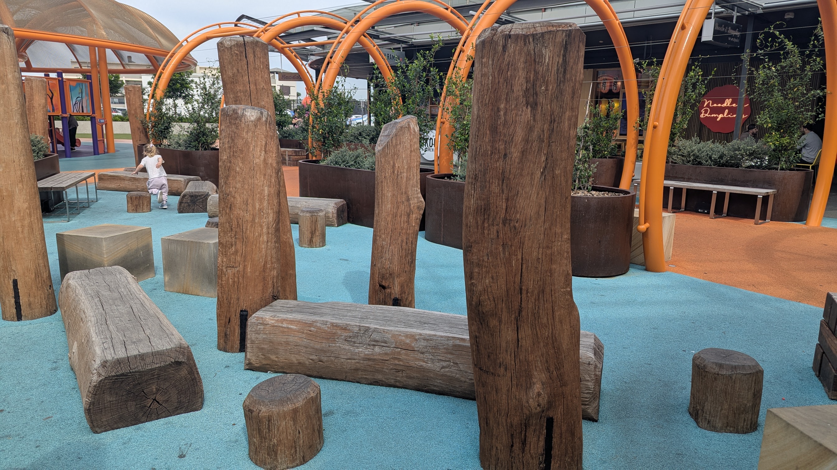 Wooden beams and round stumps for balancing.