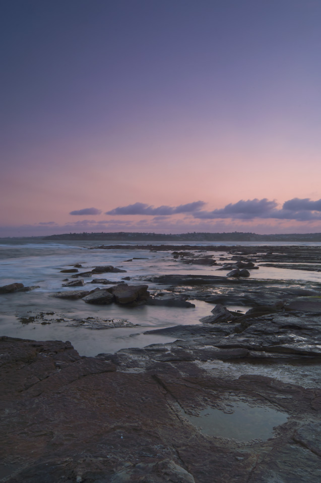 Sunset over Long Reef headland and ocean