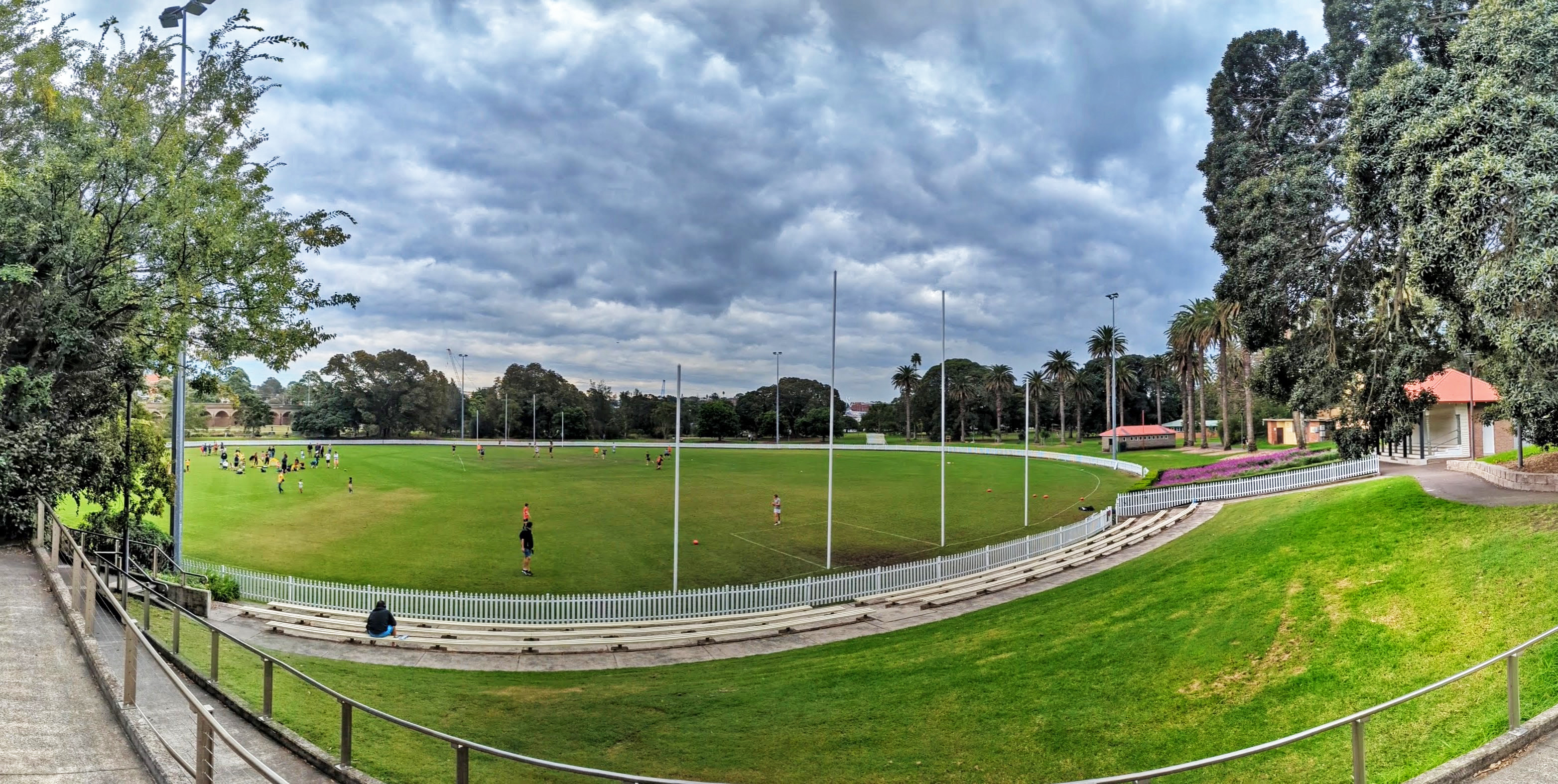 The open green sports field and lawns at Jubilee Park, Glebe, used for weekend kids' sport.