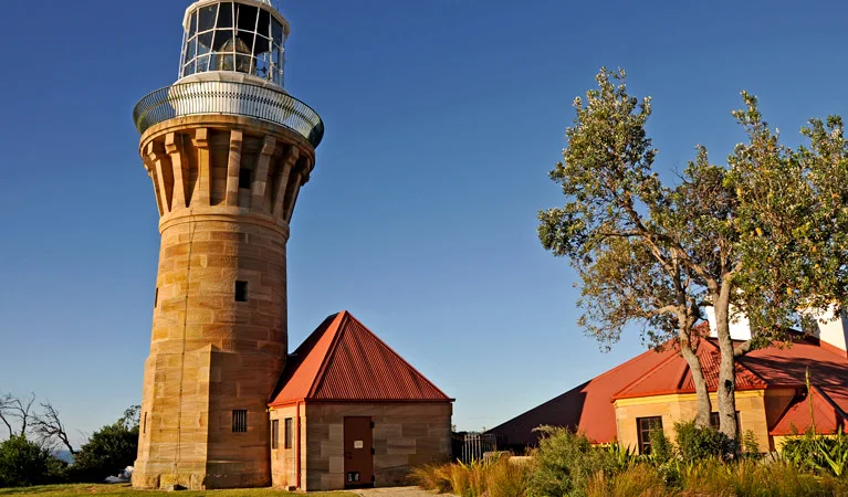 View of Barrenjoey Lighthouse and the headland with Pittwater and Palm Beach in the distance.