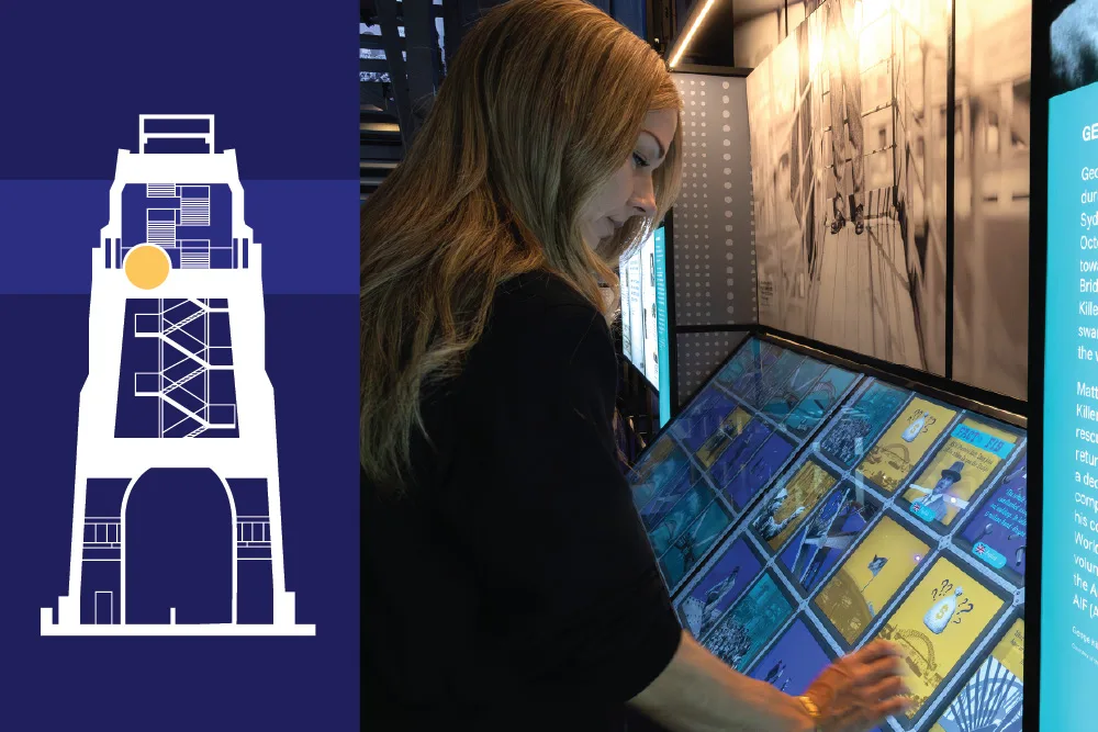 Woman interacting with a colorful touchscreen display at Sydney Harbour Bridge Museum, with bridge diagram visible on wall behind her