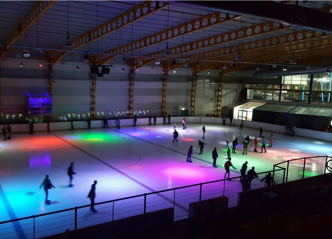 Weekend ice disco session under coloured lights at Erina Ice Arena