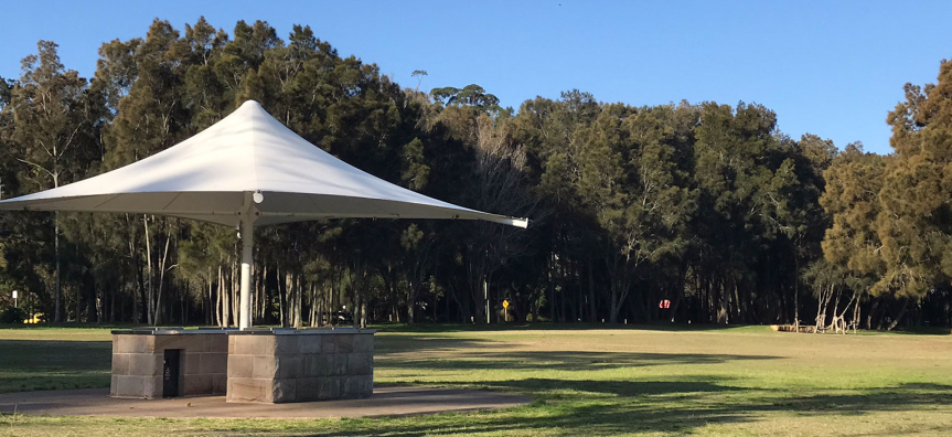 Sheltered picnic tables and BBQ area at Bilarong Reserve, North Narrabeen.